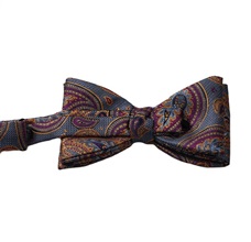 Blue bow tie with garnet and ocher paisley reverse